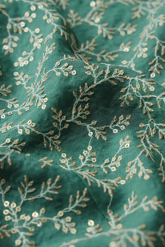 AIzaSyBcstauz-XMPRhEY21AUzeo032pxrXB5Ug - 3.25 Meter Cut Piece Of White Thread With Gold Sequins Leafy Embroidery On Teal Georgette Fabric