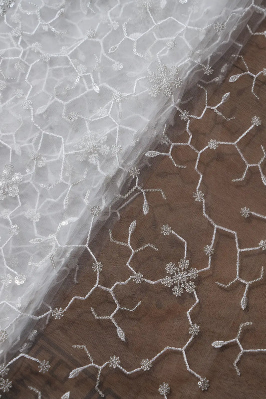 AIzaSyBcstauz-XMPRhEY21AUzeo032pxrXB5Ug - Beautiful Silver Sequins Small Floral Embroidery On White Dyeable Soft Net Fabric