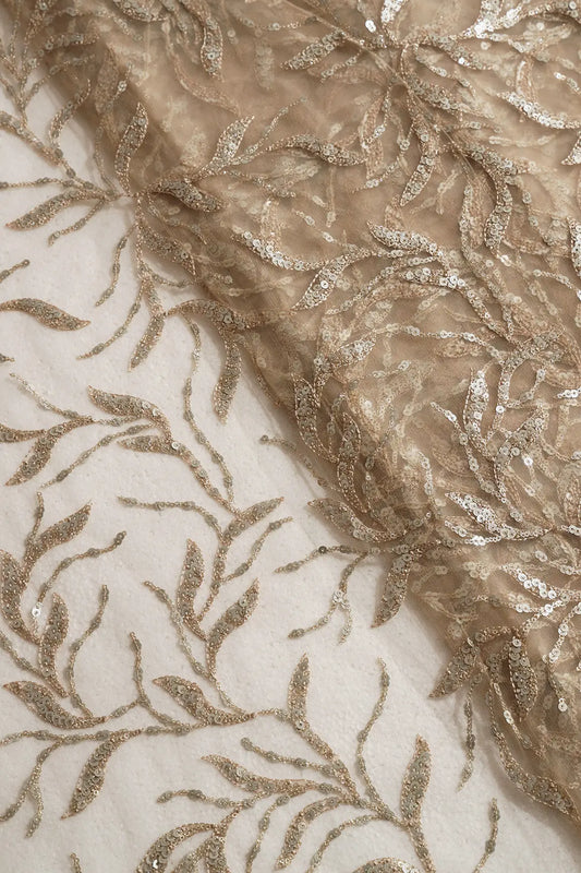 AIzaSyBcstauz-XMPRhEY21AUzeo032pxrXB5Ug - Gold And Silver Sequins Leafy Floral Embroidery On Beige Soft Net Fabric