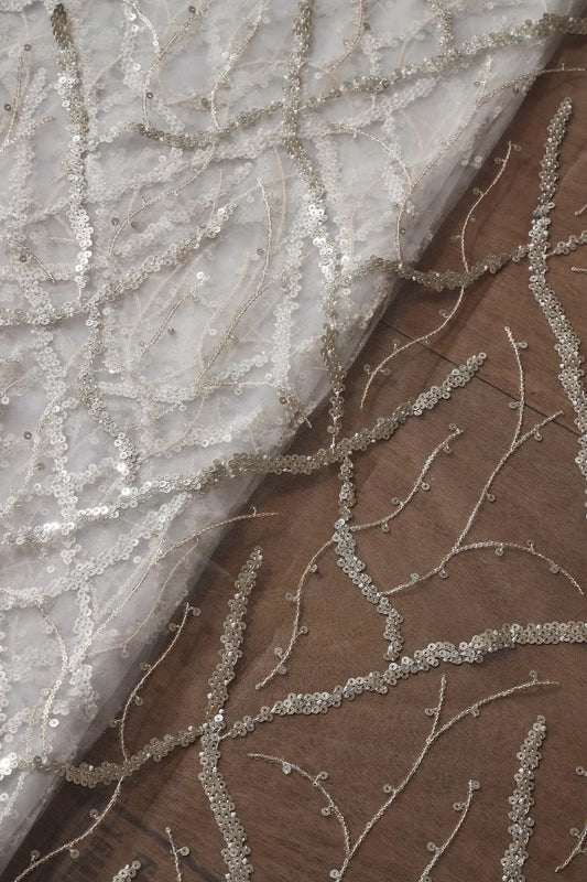 Silver Sequins Geometric Embroidery On White Dyeable Soft Net Fabric