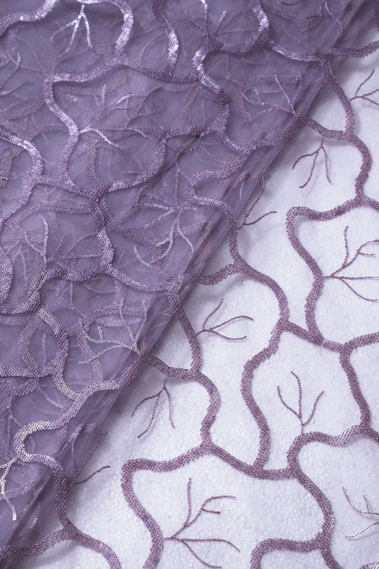 AIzaSyBcstauz-XMPRhEY21AUzeo032pxrXB5Ug - Light Lilac Sequins Abstract Embroidery On Lilac Soft Net Fabric