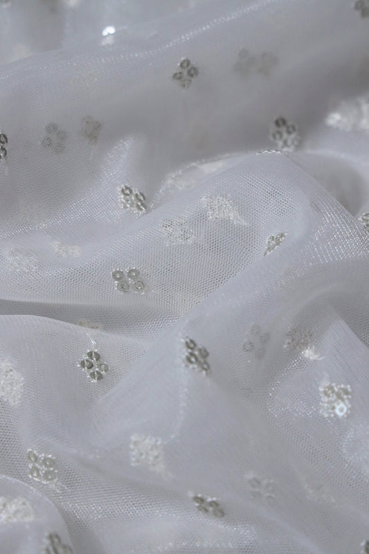 Small Motif Sequins Embroidery Work On White Dyeable Soft Net Fabric
