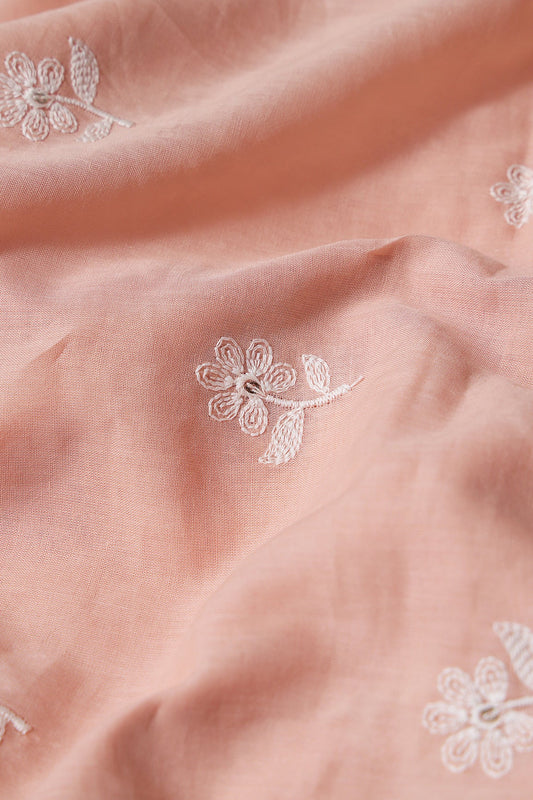 White Thread Small Floral Embroidery On Peach Pure Mul Cotton Fabric