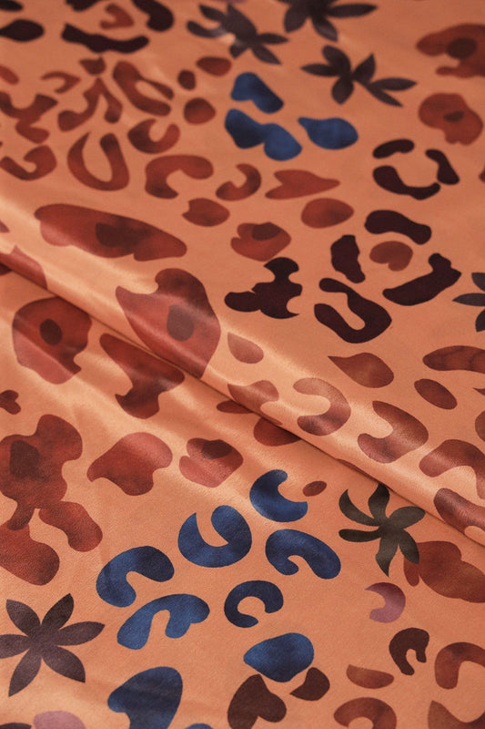 AIzaSyBcstauz-XMPRhEY21AUzeo032pxrXB5Ug - Brown And Blue Abstract Print On Pastel Orange Crepe Fabric