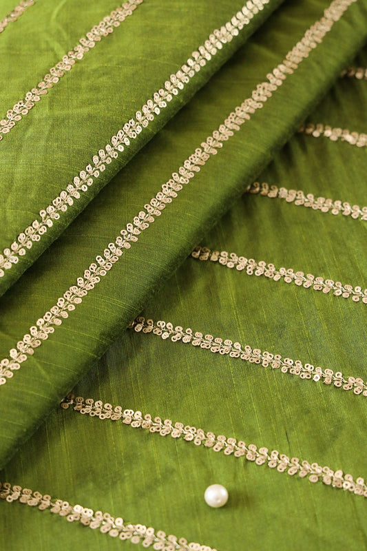 AIzaSyBcstauz-XMPRhEY21AUzeo032pxrXB5Ug - Gold Sequins With Gold Zari Stripes Embroidery Work On Dark Olive Raw Silk Fabric