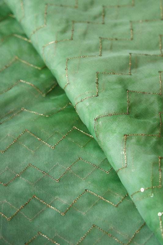 AIzaSyBcstauz-XMPRhEY21AUzeo032pxrXB5Ug - Gold Sequins Chevron Embroidery Work On Tie & Dye Olive Organza Fabric