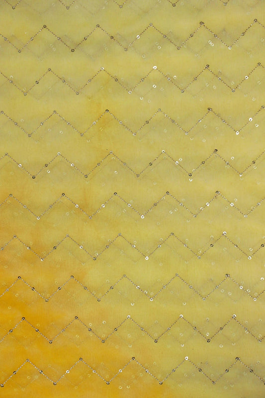 AIzaSyBcstauz-XMPRhEY21AUzeo032pxrXB5Ug - Gold Sequins Chevron Embroidery Work On Tie & Dye Yellow Organza Fabric