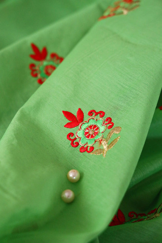 Orange And Green Floral Embroidery On Parrot Green Chanderi Fabric