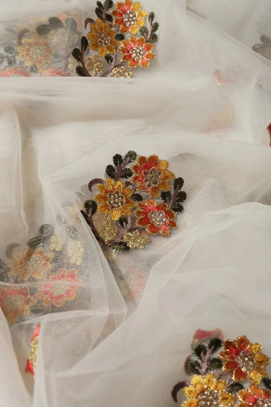 Orange And Mustard Thread With Gold Zari Floral Embroidery On Cream Soft Net Fabric
