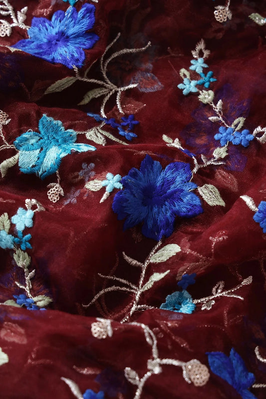 Royal Blue And Teal Thread With Gold Zari Floral Embroidery On Maroon Organza Fabric