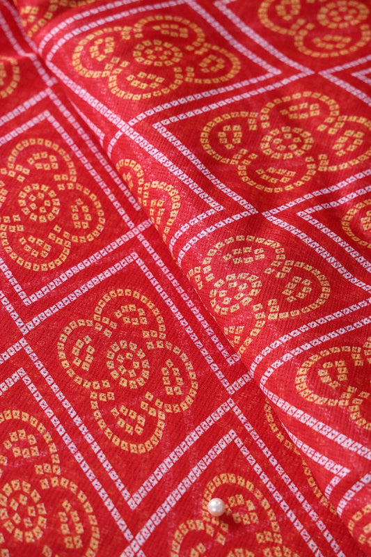 White And Yellow Bandhani Print On Red Kota Doria Fabric