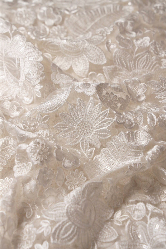 White Thread With Sequins Heavy Floral Embroidery On White Dyeable Soft Net Fabric