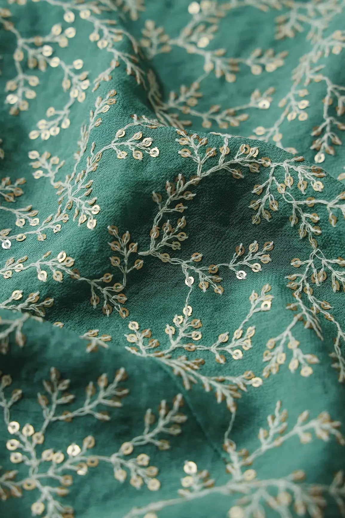 AIzaSyBcstauz-XMPRhEY21AUzeo032pxrXB5Ug - 3.25 Meter Cut Piece Of White Thread With Gold Sequins Leafy Embroidery On Teal Georgette Fabric