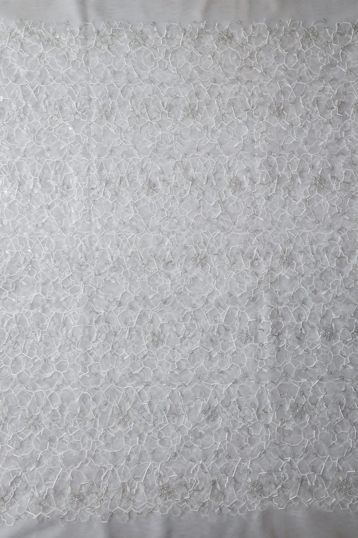 AIzaSyBcstauz-XMPRhEY21AUzeo032pxrXB5Ug - Beautiful Silver Sequins Small Floral Embroidery On White Dyeable Soft Net Fabric