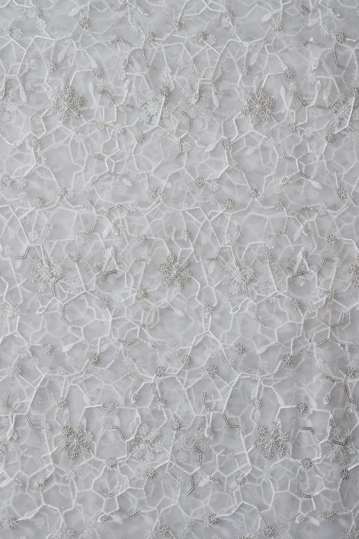 AIzaSyBcstauz-XMPRhEY21AUzeo032pxrXB5Ug - Beautiful Silver Sequins Small Floral Embroidery On White Dyeable Soft Net Fabric