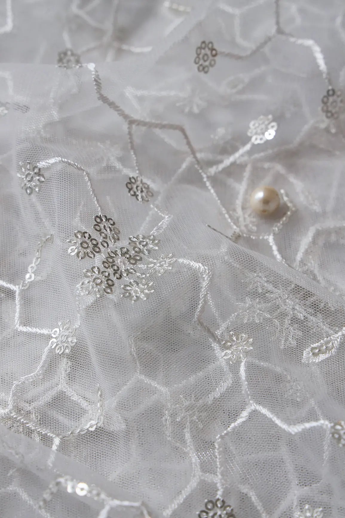 AIzaSyBcstauz-XMPRhEY21AUzeo032pxrXB5Ug - Beautiful Silver Sequins Small Floral Embroidery On White Dyeable Soft Net Fabric