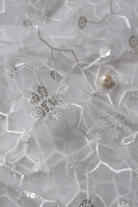AIzaSyBcstauz-XMPRhEY21AUzeo032pxrXB5Ug - Beautiful Silver Sequins Small Floral Embroidery On White Dyeable Soft Net Fabric