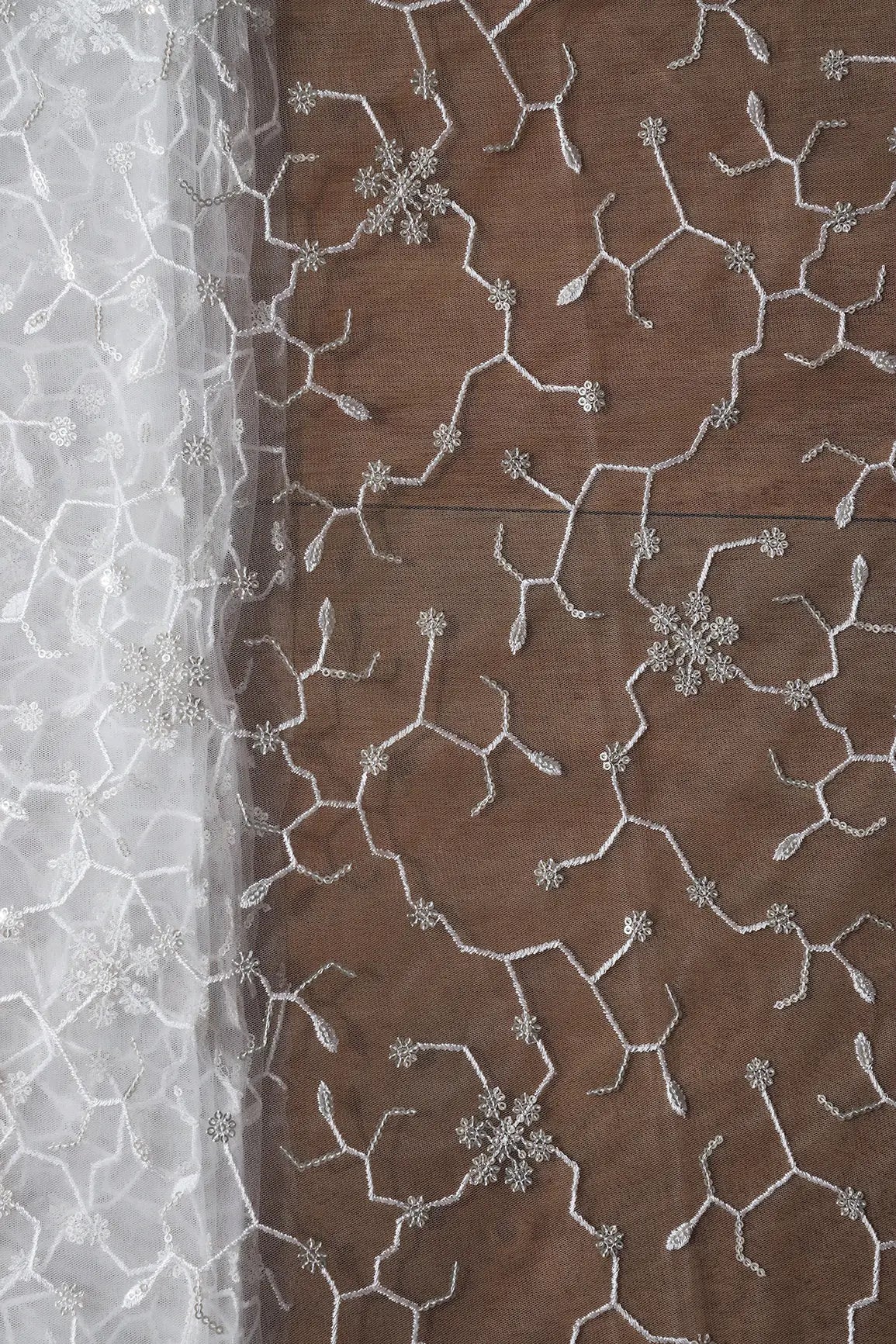 AIzaSyBcstauz-XMPRhEY21AUzeo032pxrXB5Ug - Beautiful Silver Sequins Small Floral Embroidery On White Dyeable Soft Net Fabric