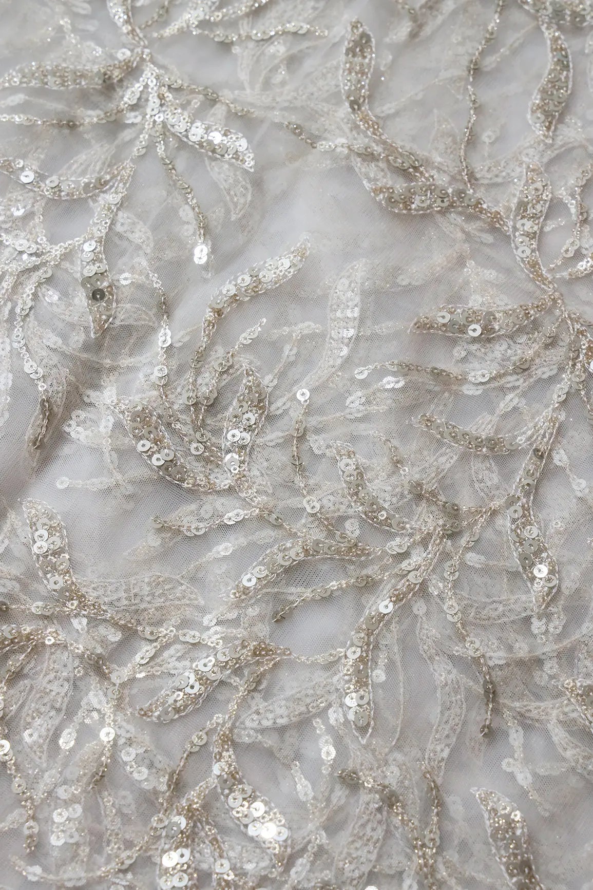 AIzaSyBcstauz-XMPRhEY21AUzeo032pxrXB5Ug - Gold And Silver Sequins Leafy Floral Embroidery On Dyeable White Soft Net Fabric