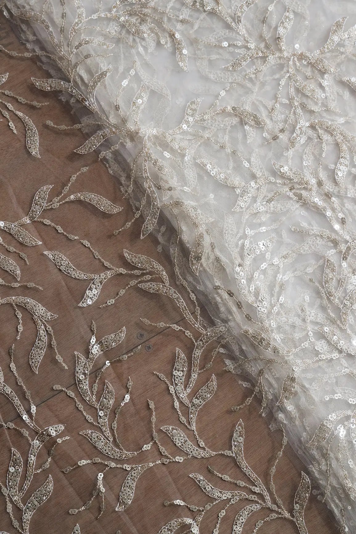 AIzaSyBcstauz-XMPRhEY21AUzeo032pxrXB5Ug - Gold And Silver Sequins Leafy Floral Embroidery On Dyeable White Soft Net Fabric