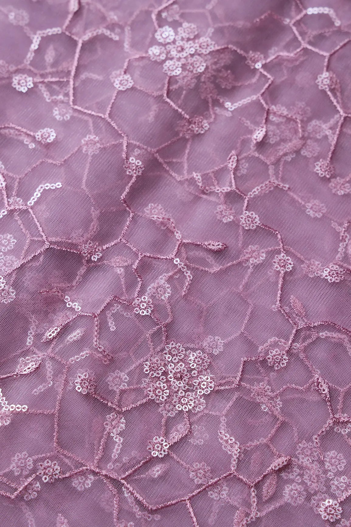 AIzaSyBcstauz-XMPRhEY21AUzeo032pxrXB5Ug - Beautiful Water Sequins Small Floral Embroidery On Mauve Soft Net Fabric