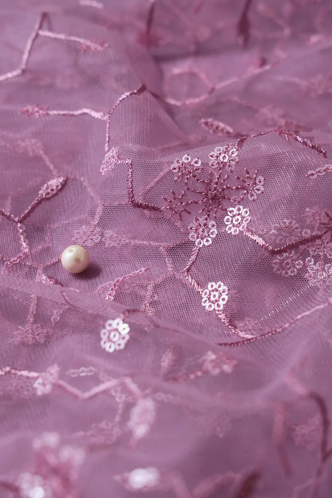 AIzaSyBcstauz-XMPRhEY21AUzeo032pxrXB5Ug - Beautiful Water Sequins Small Floral Embroidery On Mauve Soft Net Fabric