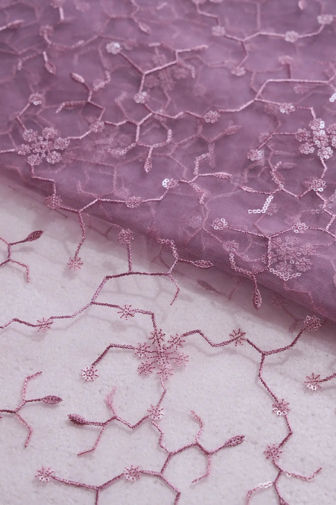 AIzaSyBcstauz-XMPRhEY21AUzeo032pxrXB5Ug - Beautiful Water Sequins Small Floral Embroidery On Mauve Soft Net Fabric