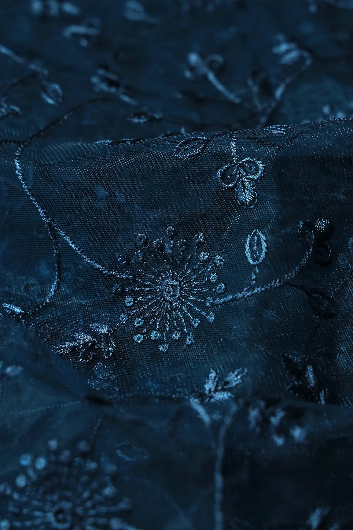 AIzaSyBcstauz-XMPRhEY21AUzeo032pxrXB5Ug - Blue Sequins With Blue Thread Floral Embroidery On Prussian Blue Soft Net Fabric