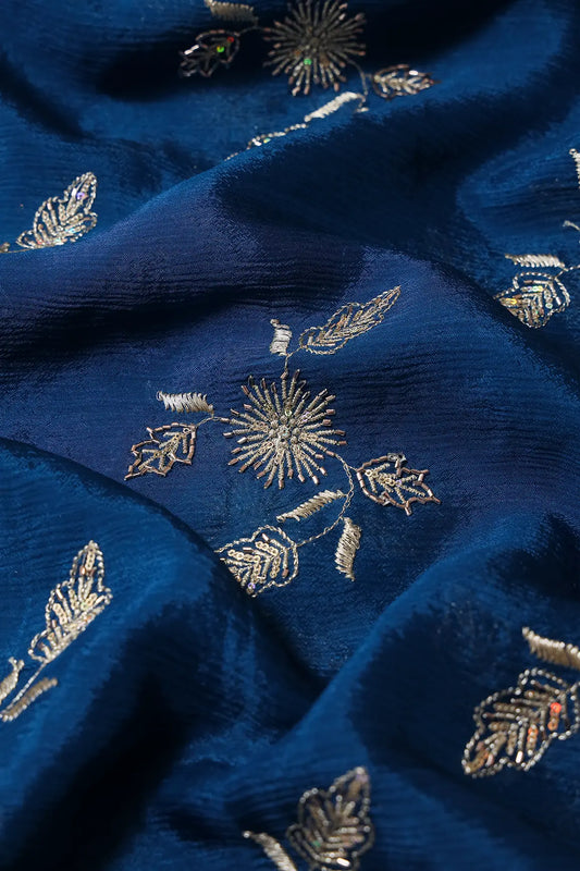 AIzaSyBcstauz-XMPRhEY21AUzeo032pxrXB5Ug - Gold Sequins With Beads And Gold Zari Floral Butta Embroidery On Prussian Blue Chinnon Chiffon Fabric