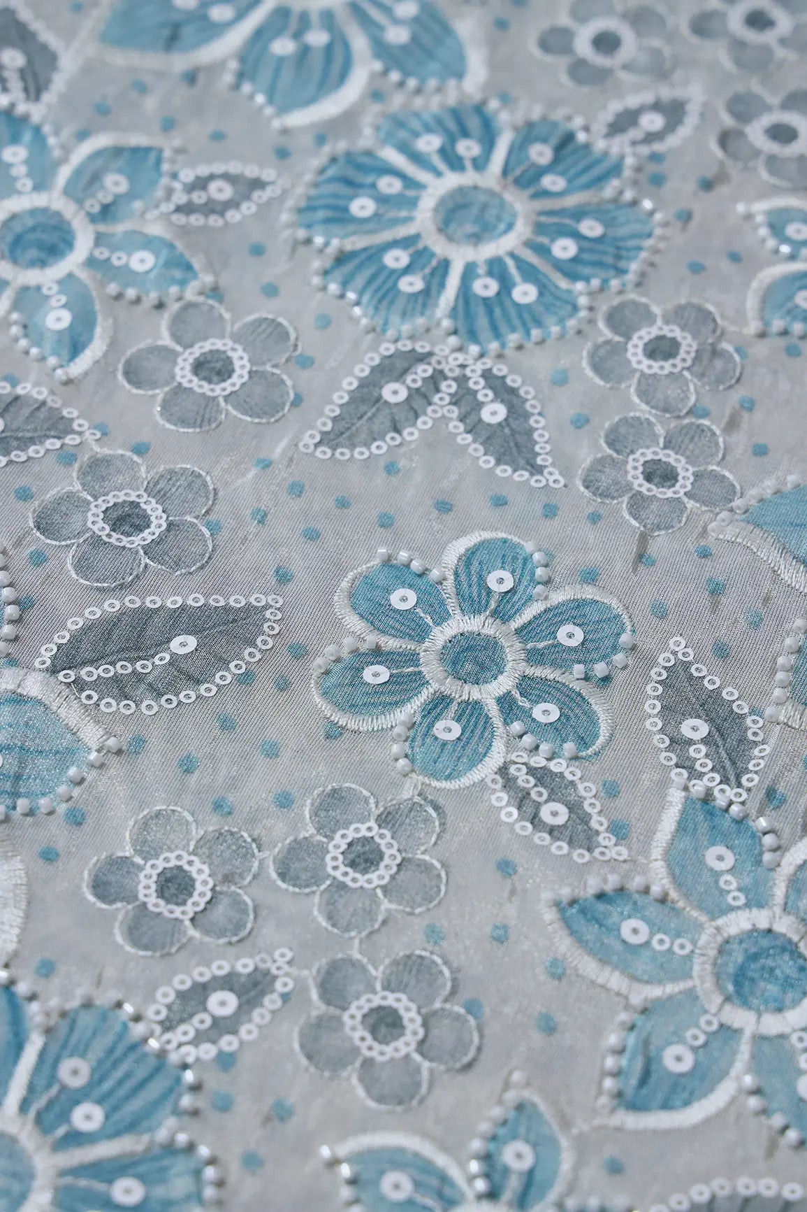AIzaSyBcstauz-XMPRhEY21AUzeo032pxrXB5Ug - Floral Position Print With White Beads And White Sequins Embroidery On Light Grey Viscose Zari Tissue Fabric