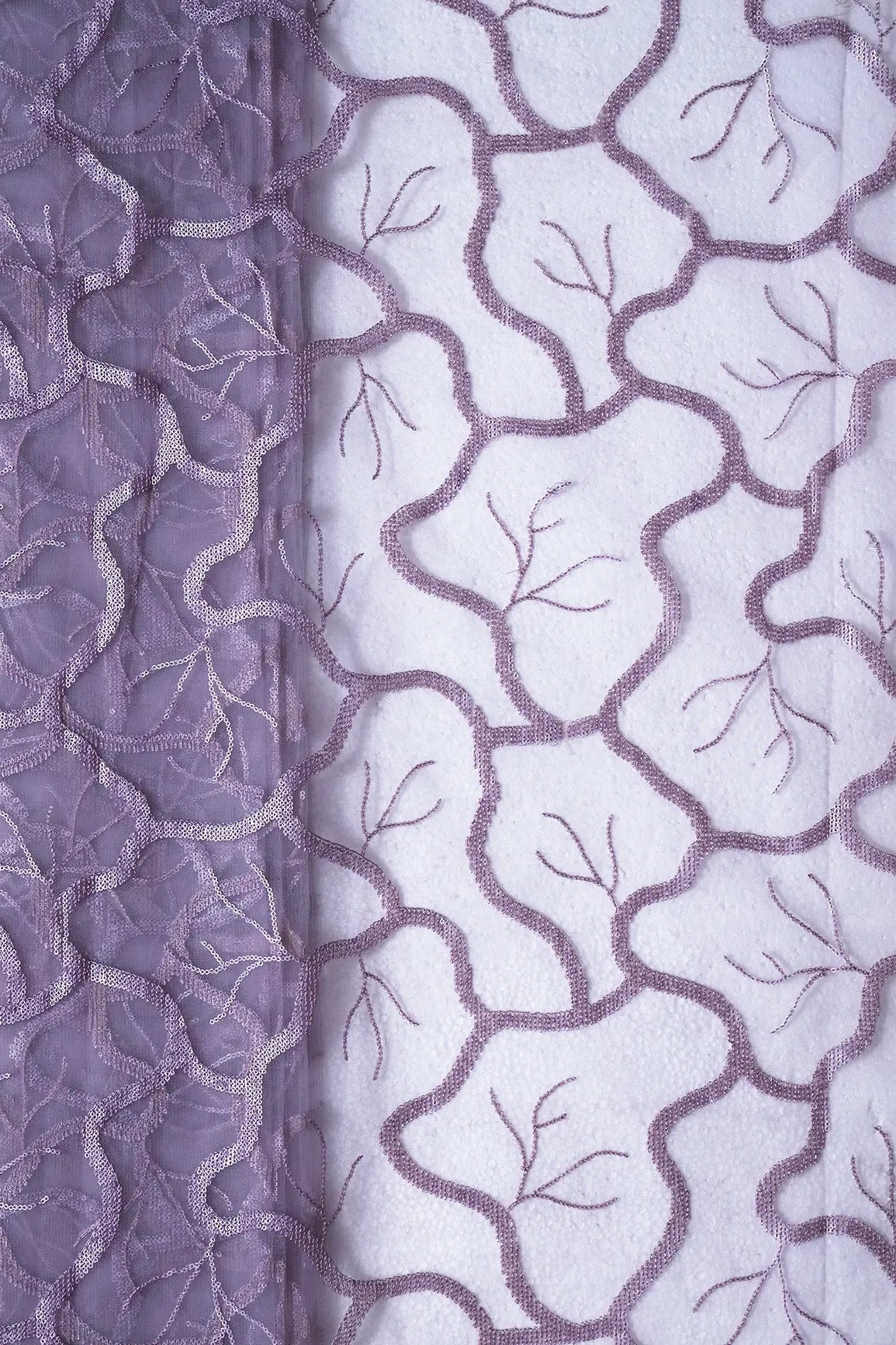 AIzaSyBcstauz-XMPRhEY21AUzeo032pxrXB5Ug - Light Lilac Sequins Abstract Embroidery On Lilac Soft Net Fabric