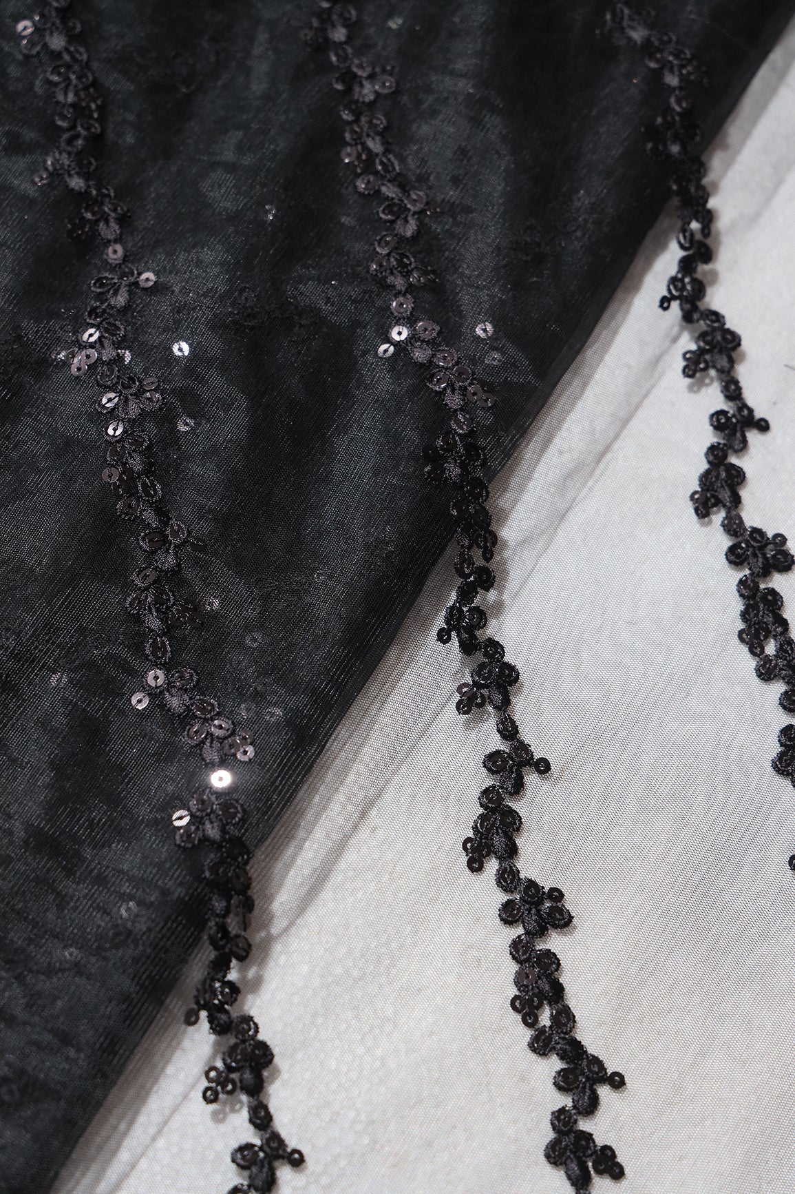 AIzaSyBcstauz-XMPRhEY21AUzeo032pxrXB5Ug - Black Thread With Sequins Strip Embroidery Work On Black Soft Net Fabric