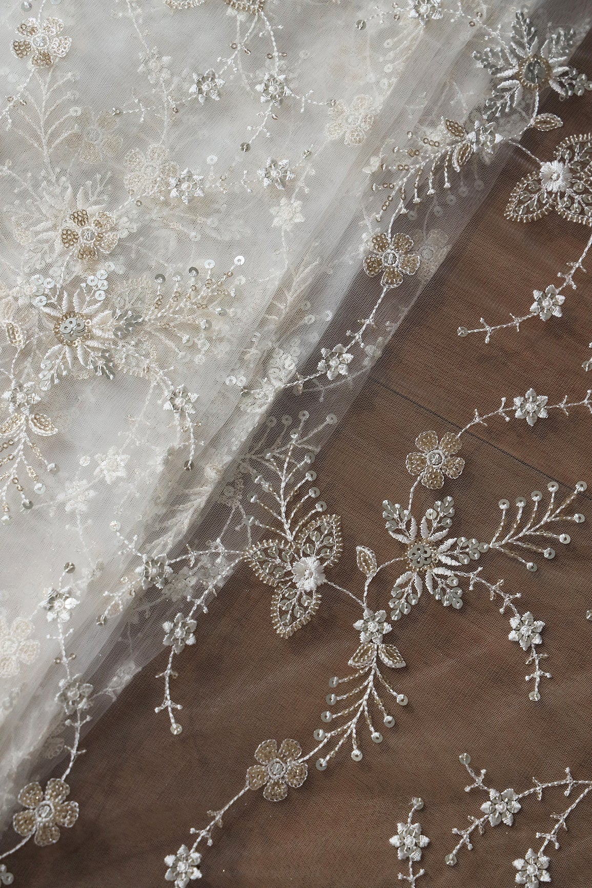 AIzaSyBcstauz-XMPRhEY21AUzeo032pxrXB5Ug - Beautiful White Thread With Sequins Floral Embroidery Work On White Dyeable Soft Net Fabric