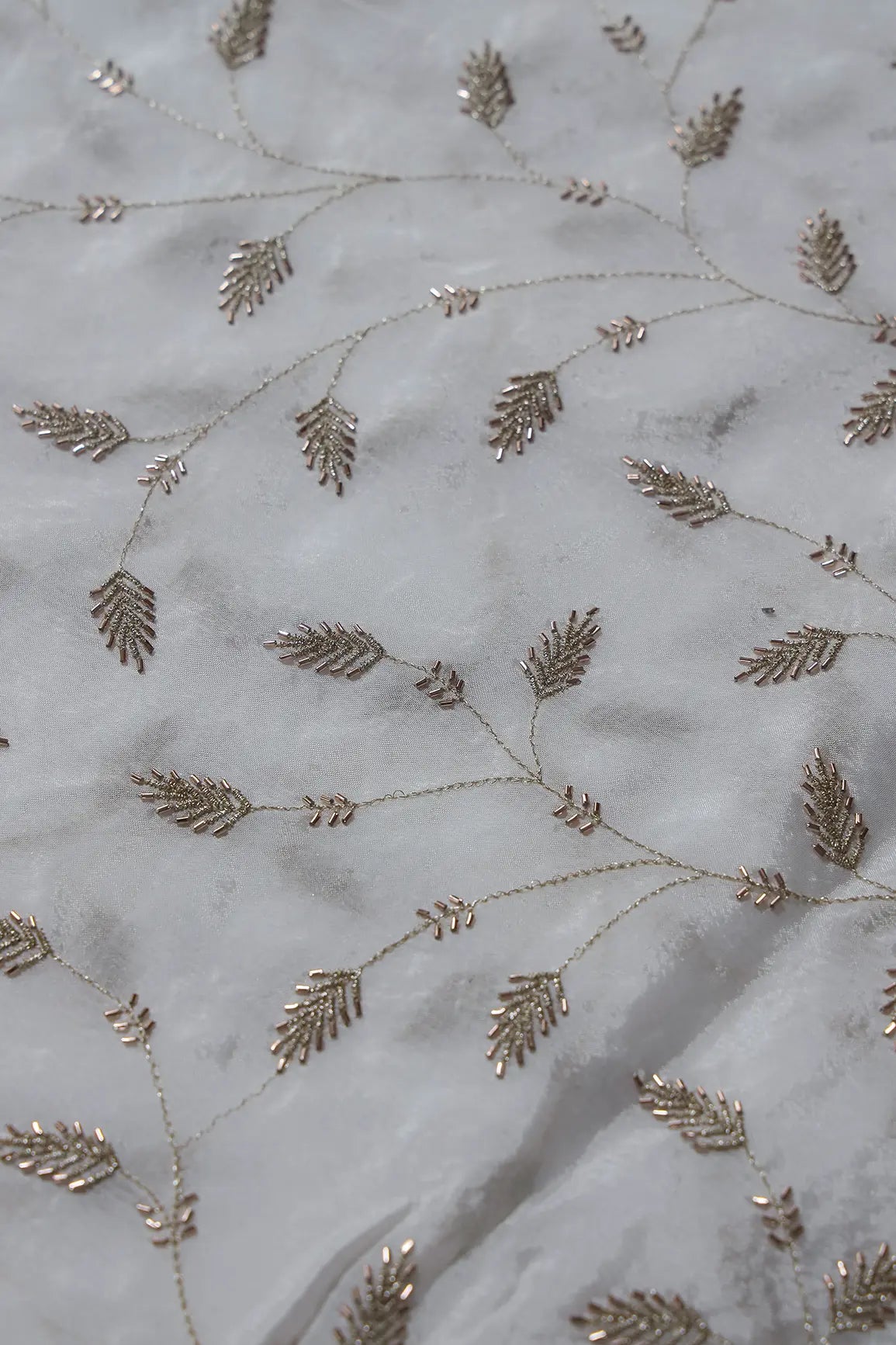 AIzaSyBcstauz-XMPRhEY21AUzeo032pxrXB5Ug - Gold Zari With Beads Leafy Embroidery Work On White Dyeable Chinnon Chiffon Fabric