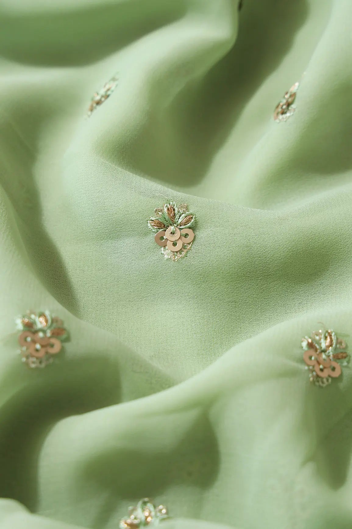 AIzaSyBcstauz-XMPRhEY21AUzeo032pxrXB5Ug - Gold Sequins With Zari Small Floral Booti Embroidery On Olive Georgette Fabric