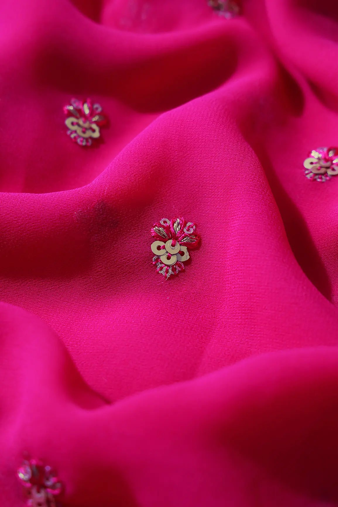 AIzaSyBcstauz-XMPRhEY21AUzeo032pxrXB5Ug - Gold Sequins With Zari Small Floral Booti Embroidery On Fuchsia Georgette Fabric