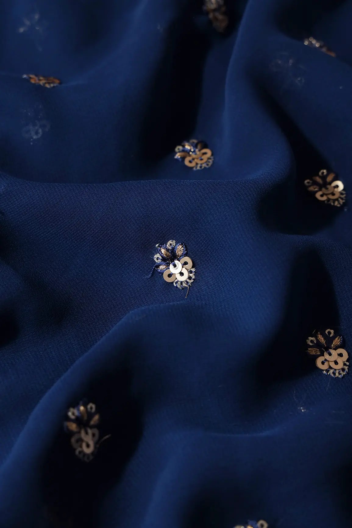 AIzaSyBcstauz-XMPRhEY21AUzeo032pxrXB5Ug - Gold Sequins With Zari Small Floral Booti Embroidery On Prussian Blue Georgette Fabric