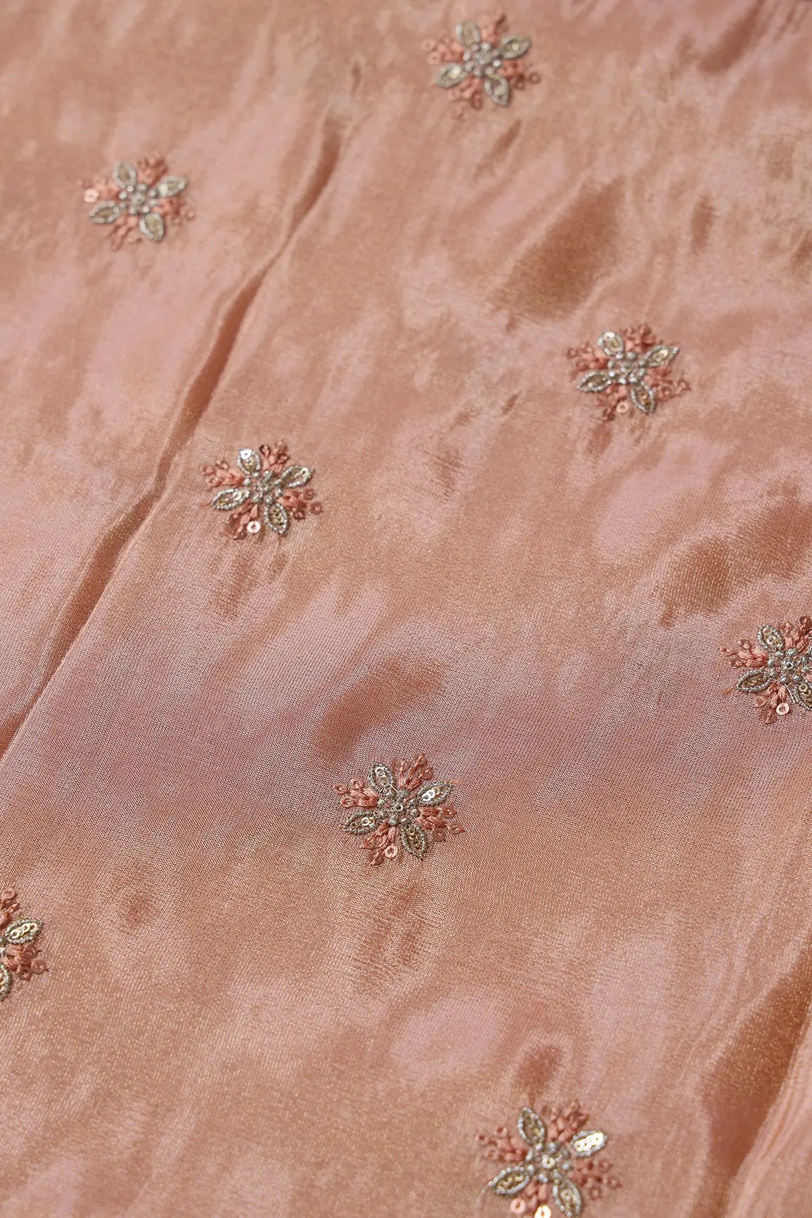 AIzaSyBcstauz-XMPRhEY21AUzeo032pxrXB5Ug - Gold Sequins And Zari Floral Booti Embroidery Work On Peach Pure Viscose Zari Tissue Fabric