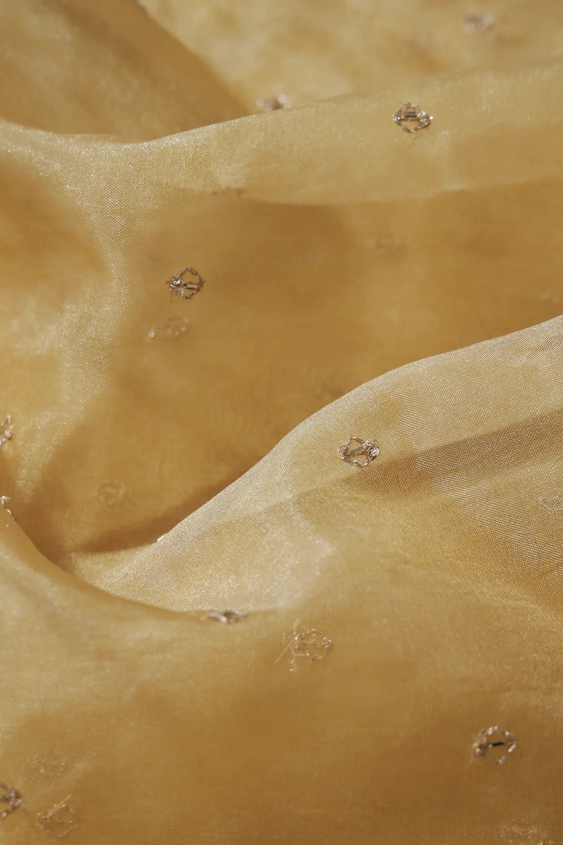 AIzaSyBcstauz-XMPRhEY21AUzeo032pxrXB5Ug - Cut Dana Beads With Zari Small Motif Embroidery On Tan Beige Organza Fabric