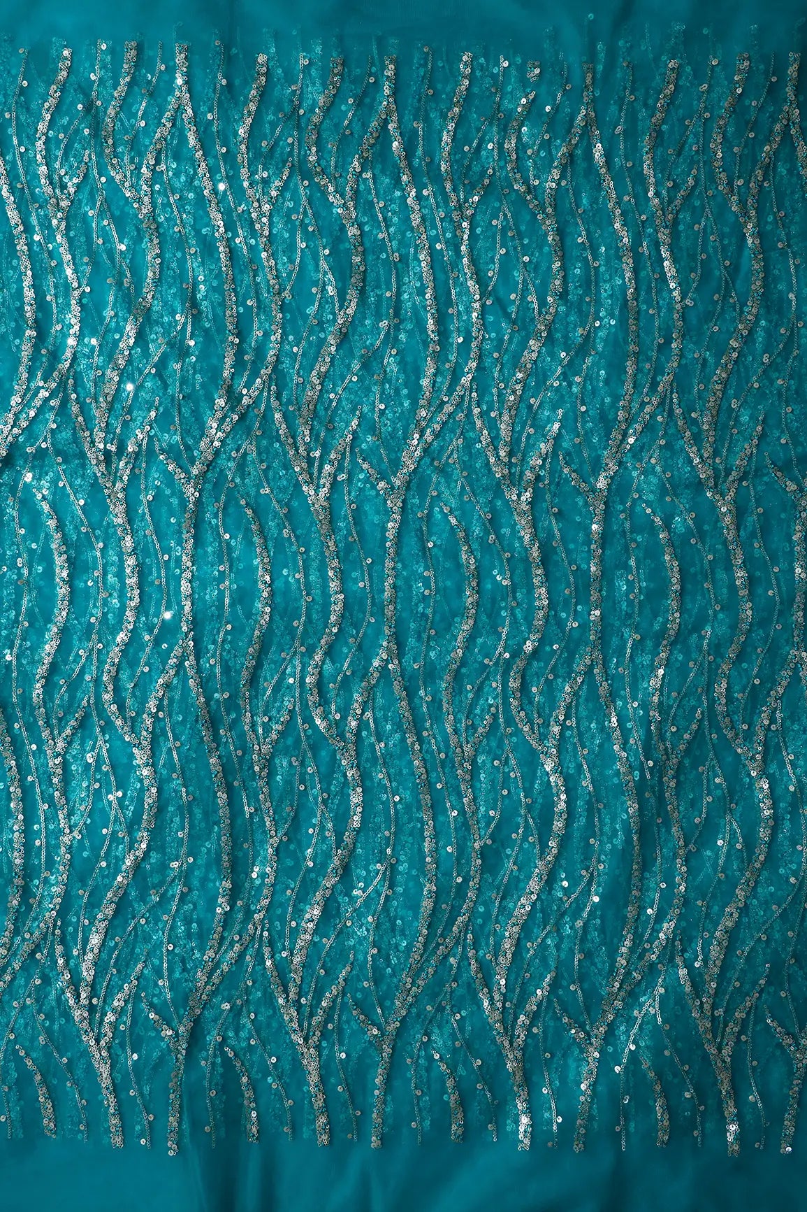 AIzaSyBcstauz-XMPRhEY21AUzeo032pxrXB5Ug - Gold And Silver Sequins With Peacock Blue Thread Wavy Embroidery On Peacock Blue Soft Net Fabric