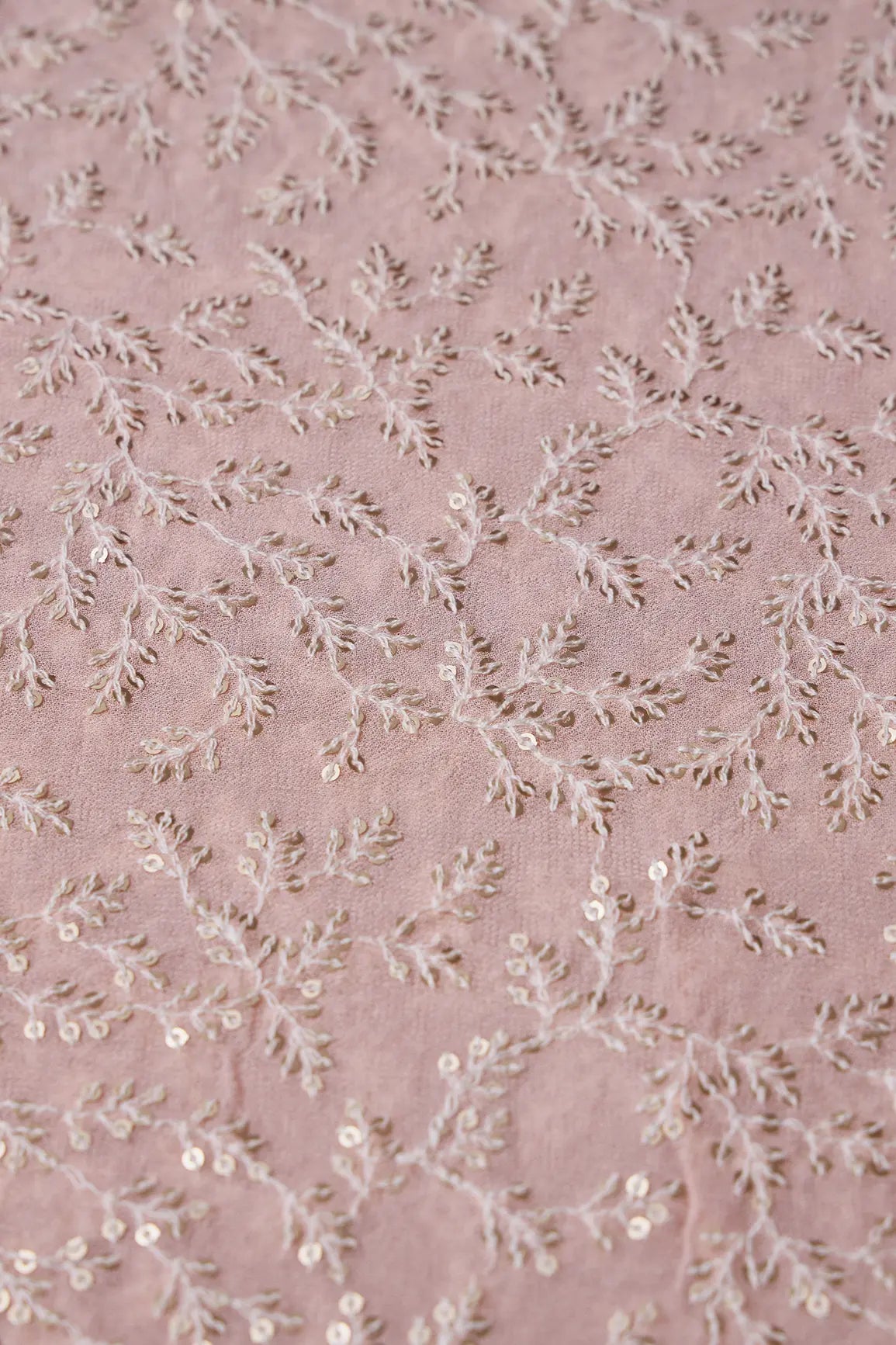 AIzaSyBcstauz-XMPRhEY21AUzeo032pxrXB5Ug - 1.90 Meter Cut Piece Of White Thread With Gold Sequins Leafy Embroidery On Peach Georgette Fabric