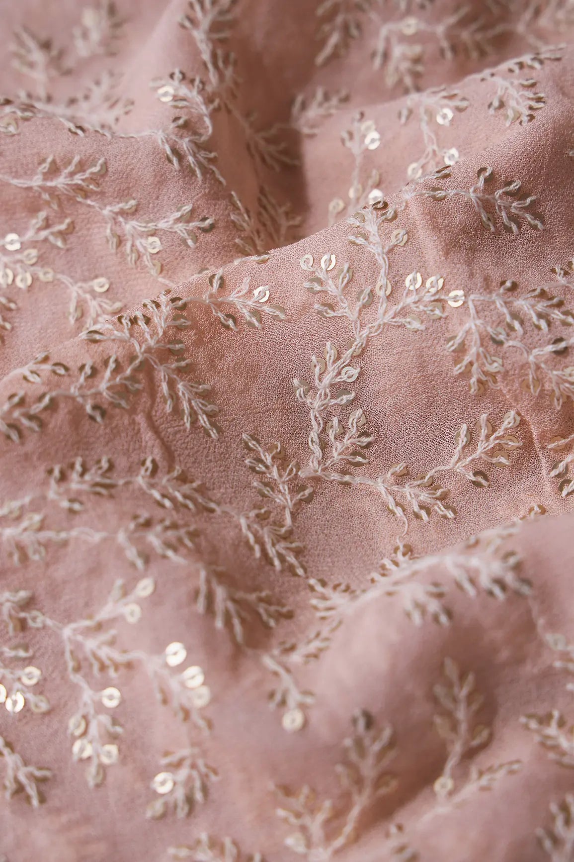 AIzaSyBcstauz-XMPRhEY21AUzeo032pxrXB5Ug - 1.90 Meter Cut Piece Of White Thread With Gold Sequins Leafy Embroidery On Peach Georgette Fabric