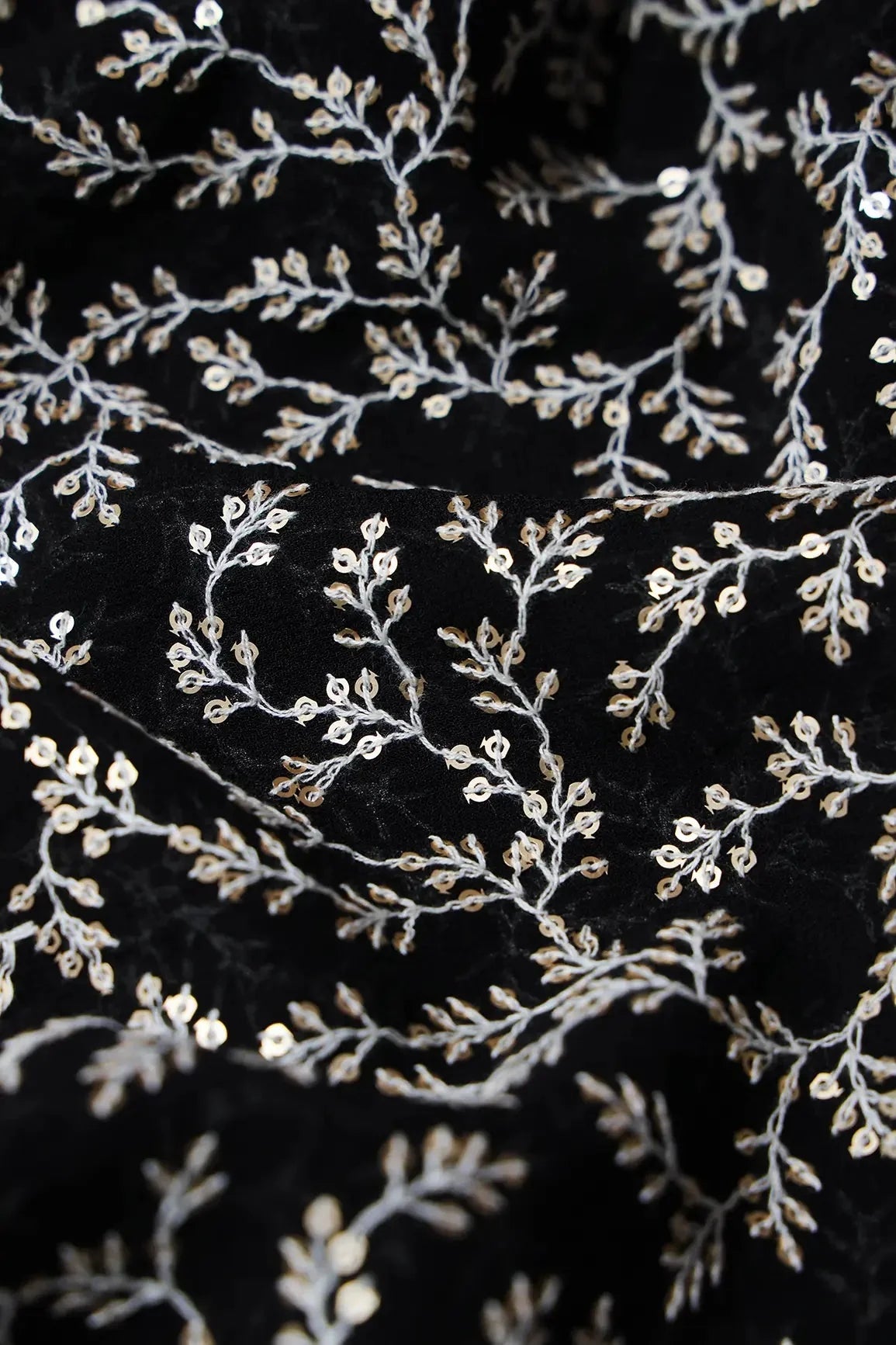 AIzaSyBcstauz-XMPRhEY21AUzeo032pxrXB5Ug - 3.90 Meter Cut Piece Of White Thread With Gold Sequins Leafy Embroidery On Black Georgette Fabric
