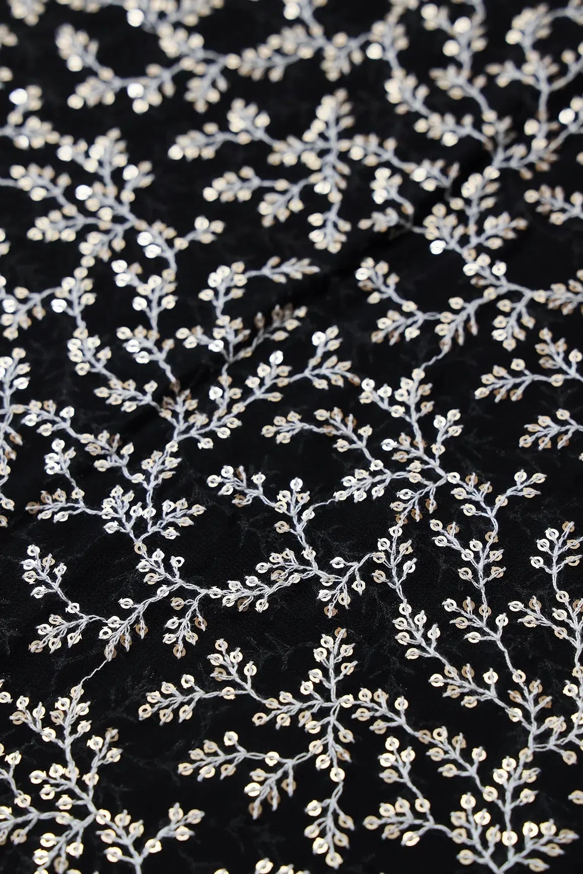 AIzaSyBcstauz-XMPRhEY21AUzeo032pxrXB5Ug - 3.90 Meter Cut Piece Of White Thread With Gold Sequins Leafy Embroidery On Black Georgette Fabric