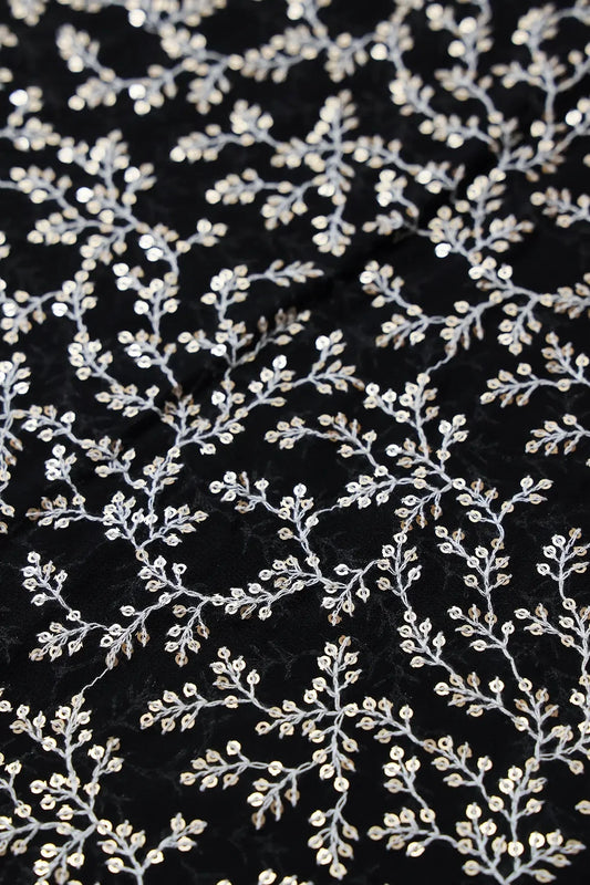 AIzaSyBcstauz-XMPRhEY21AUzeo032pxrXB5Ug - 3.90 Meter Cut Piece Of White Thread With Gold Sequins Leafy Embroidery On Black Georgette Fabric