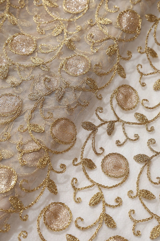 AIzaSyBcstauz-XMPRhEY21AUzeo032pxrXB5Ug - 5.75 Meter Cut Piece Of Gold Sequins With Gold Zari Leafy Embroidery On Beige Soft Net Fabric