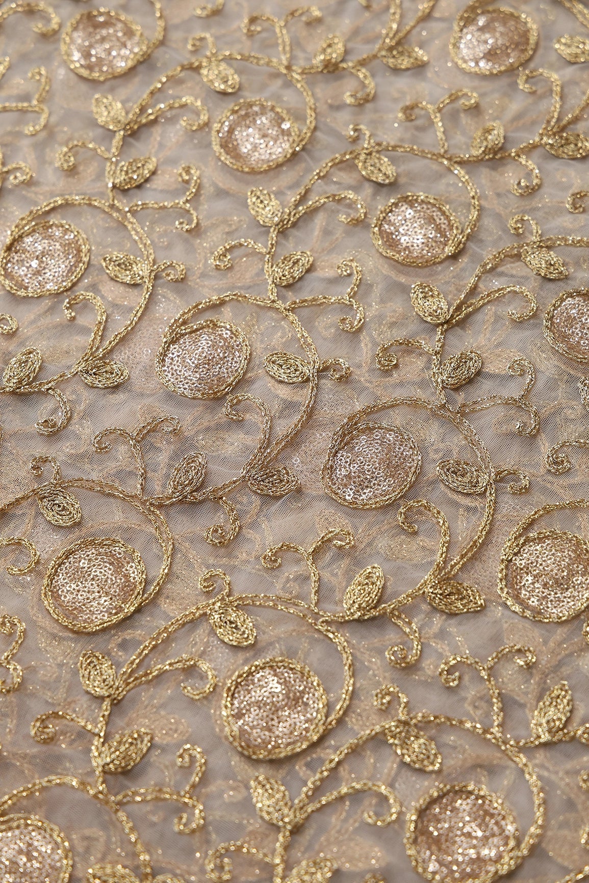 AIzaSyBcstauz-XMPRhEY21AUzeo032pxrXB5Ug - 5.75 Meter Cut Piece Of Gold Sequins With Gold Zari Leafy Embroidery On Beige Soft Net Fabric