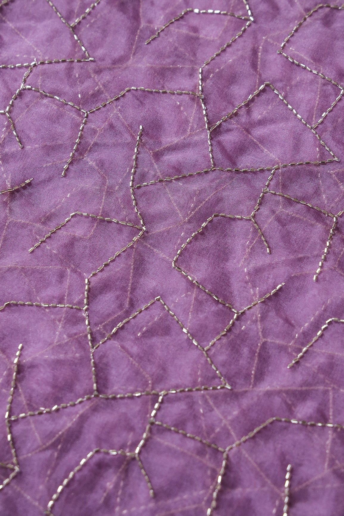 AIzaSyBcstauz-XMPRhEY21AUzeo032pxrXB5Ug - Cut Dana Beads Appealing Abstract Embroidery On Lavender Organza Fabric