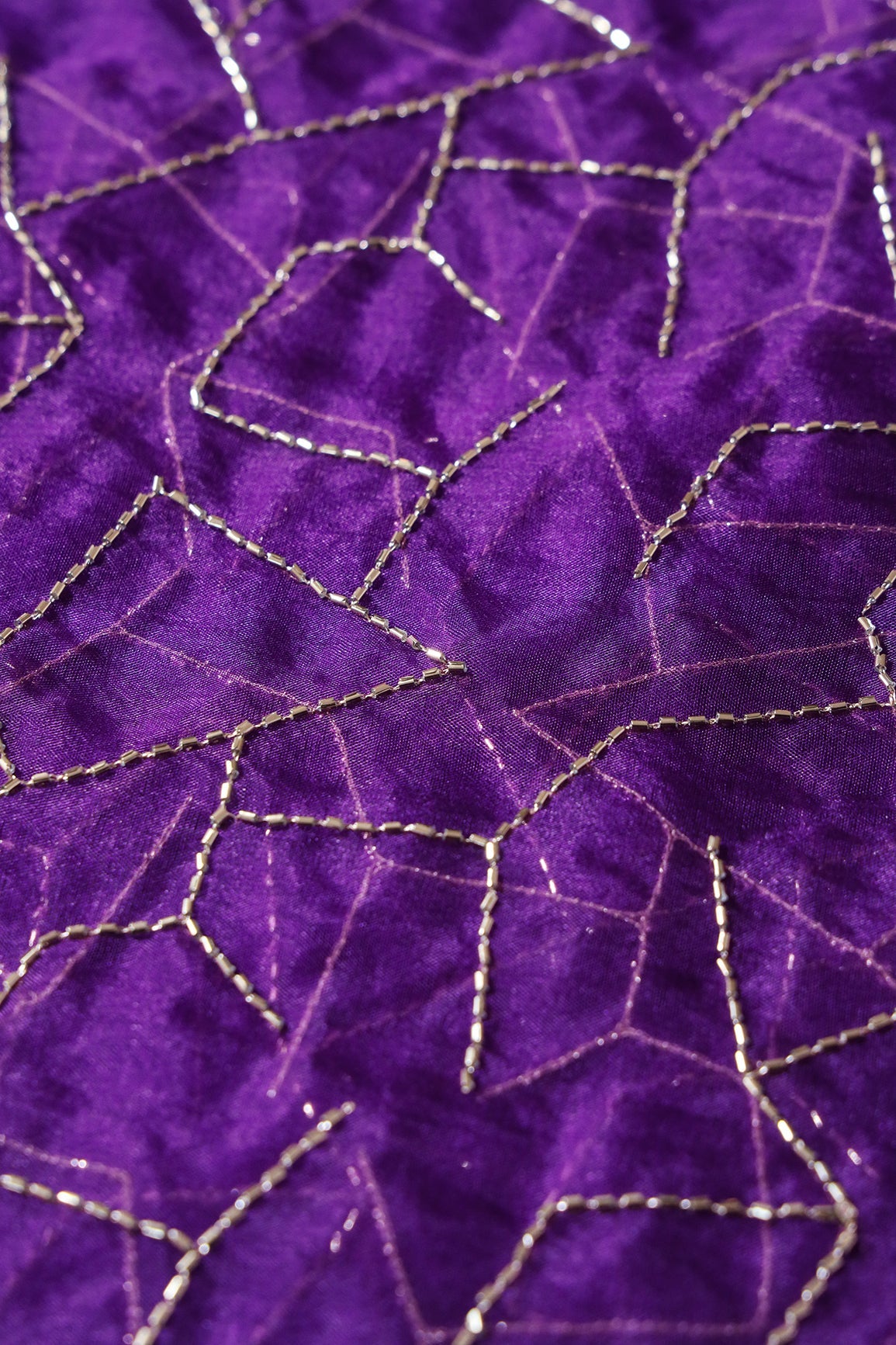 AIzaSyBcstauz-XMPRhEY21AUzeo032pxrXB5Ug - Cut Dana Beads Appealing Abstract Embroidery On Purple Organza Fabric