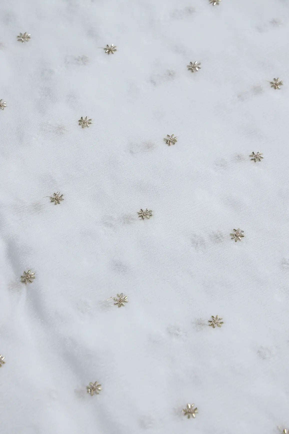 AIzaSyBcstauz-XMPRhEY21AUzeo032pxrXB5Ug - Gold Beads Cut Dana Motif Embroidery Work On White Dyeable Chinnon Chiffon Fabric